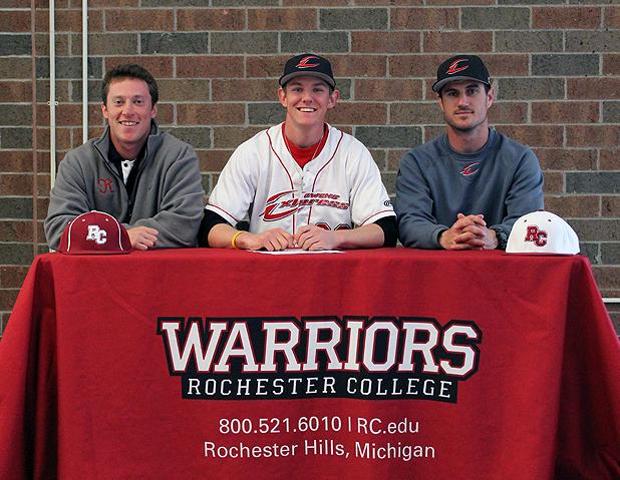 Matthew Zitny, center, is pictured with Owens head baseball coach Devin Taylor (far right) and Rochester College baseball head coach Ryan Chipka (far left) after signing to play at Rochester next year. Photo by Geoff Roberts/Owens Sports Information