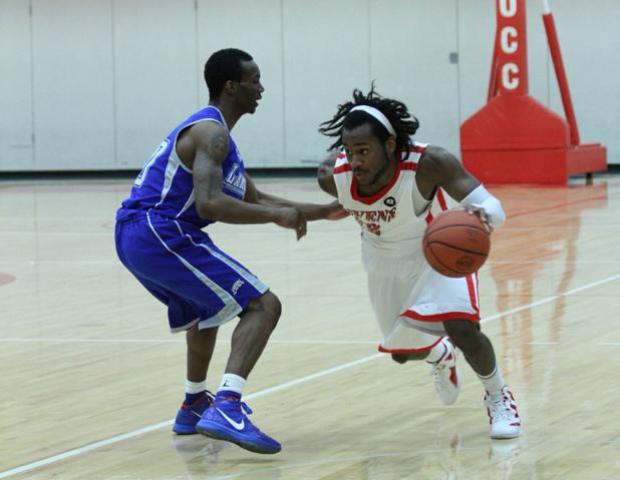 Freshman guard Justin Edmonds looks to drive against Lakeland. Photo by Cherie Guthrie