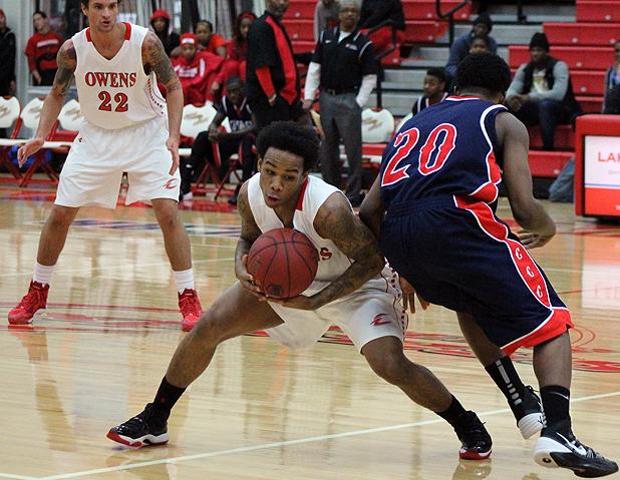 Sophomore Markese Allen strips the ball from Cuyahoga's Bradley Penman in the second half of today's 83-68 Express win. Andy Bachman (22) watches in the background. Photo by Kyle Whitaker/Owens Sports Information