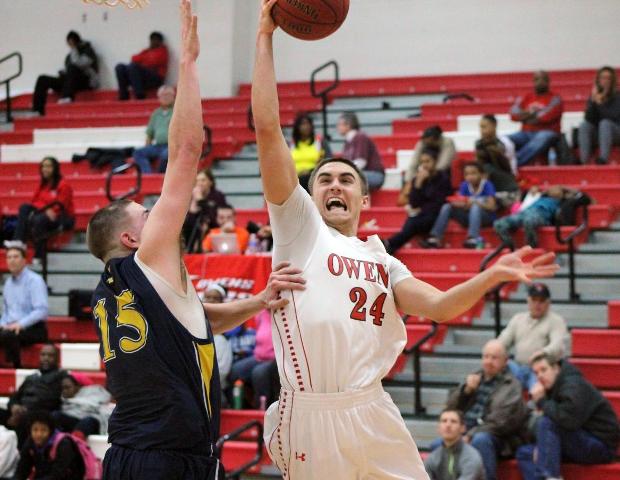 Pete Firlik goes in for a layup against Edison's Cody May in today's 107-75 win. Photo by Nicholas Huenefeld/Owens Sports Information