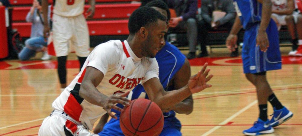 Charles Penn III looks to drive the ball against Clark State today. Photo by Kyle Brown/Owens Sports Information