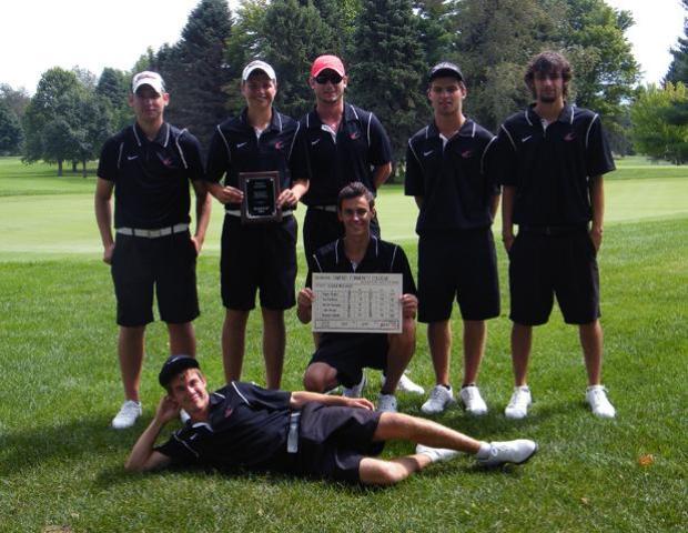 The Express men's golf team poses following their 2nd place finish in the Olivet Fall Golf Classic. Pictured are Tim Dawkins (laying down), Brandon Hoelzer (holding sign), and Darren Gessner, Luke Berger, Jason Glass, Blaze Hogan and Walter Dorosh (back row, left to right). Photo by Josh Williams/Owens Sports Information