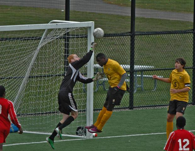 Express goalkeeper Josh Kleinow looks to make a save against a Monroe Community College player. The No. 15 Express lost 4-0 to the No. 3 Tribunes. Photo by Nicholas Huenefeld/Owens Sports Information