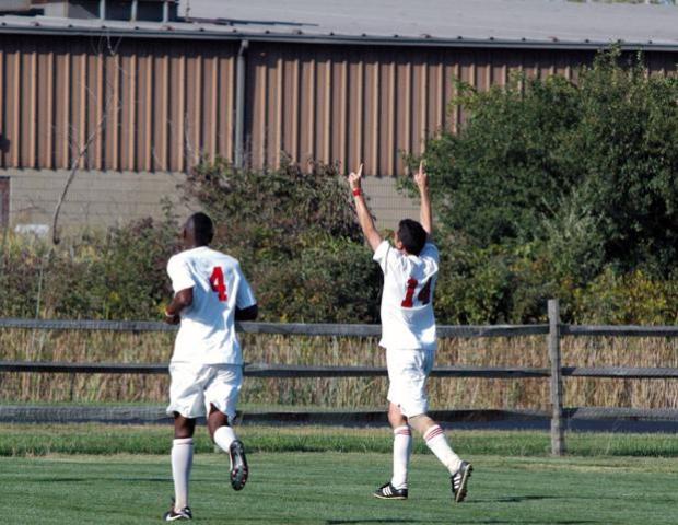 David Ortega-Gonzalez, right, celebrates his first goal of the season, which put Owens up 3-2 in the second half. Vijay Gentles (4) is pictured on the left. Photo courtesy of Nicholas Huenefeld/Owens Sports Information