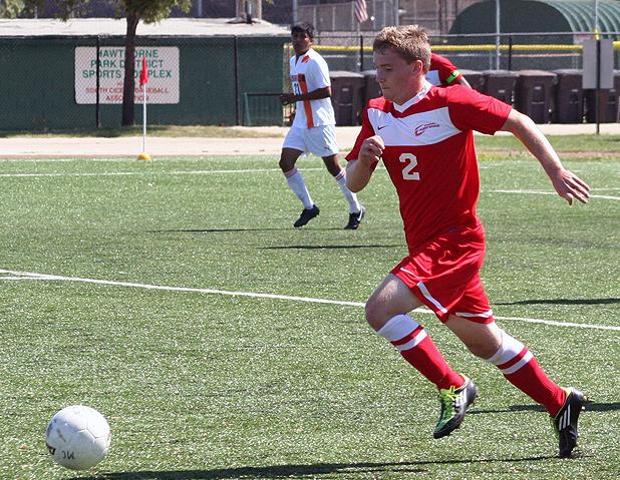 Austin Combs is pictured here in a recent match against Morton College. The freshman midfielder was named the OCCAC's co-offensive player of the week today. Photo by Bonnie Kleinow/Owens Sports Information