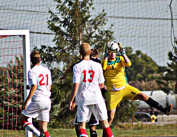 Sophomore goalkeeper Ryan Wicher grasps a loose ball. Photo by Nicholas Huenefeld/Owens Sports Information