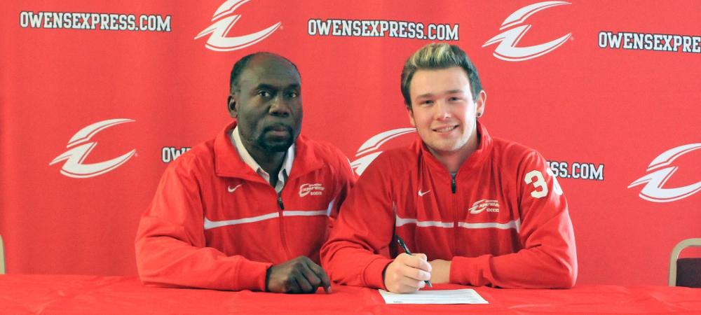 Alex Wagener joins Owens head coach Art Johnson after signing his LOI. Photo by Nicholas Huenefeld/Owens Sports Information