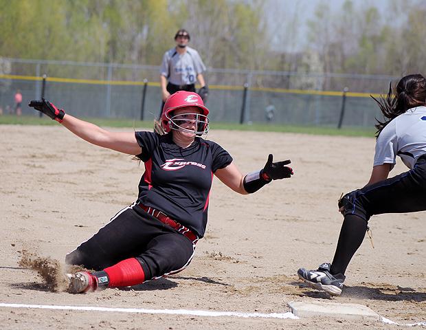 Brittany George slides into third base in today's Region XII District G tournament game against Kellogg Community College. The freshman broke two single season offensive records this year. Photo by Nicholas Huenefeld/Owens Sports Information