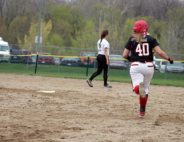 Brittany George rounds first and heads to second following her first homer of the day. Photo by Nicholas Huenefeld/Owens Sports Information