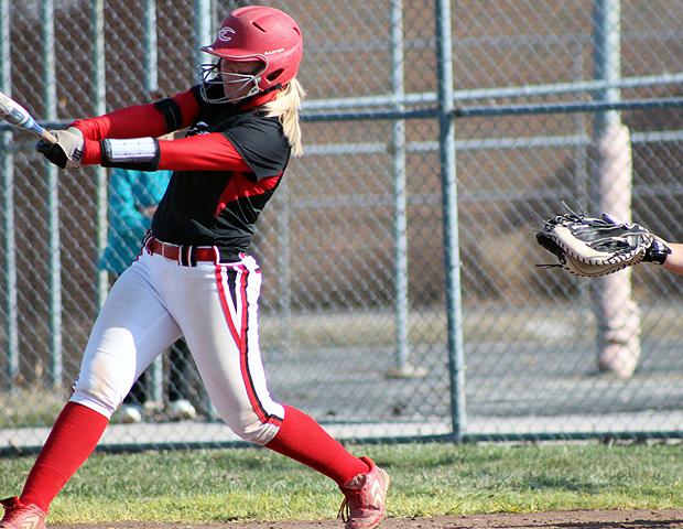 Emily Rockman drills one of her two home runs today against Oakland Community College. The sophomore now has three this year and eight in her career. Photo by Geoff Roberts/Owens Sports Information