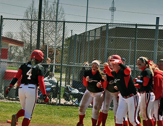 Haley Hudgin gets ready to meet her teammates at home plate after hitting her first collegiate home run in today's first game against Sinclair. Photo by Sharon Snyder/Owens Sports Information