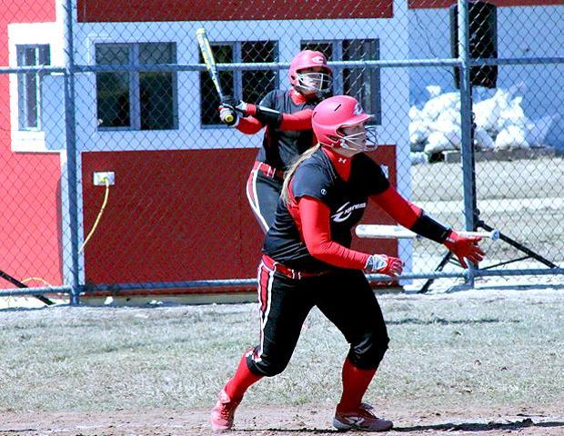 Tori Weidinger is pictured here in a familiar pose, watching her hit fly over the fence. The freshman went 5-for-5 with 3 HR, a double, five runs and seven RBIs in the second game of a doubleheader vs Cuyahoga. Photo by Geoff Roberts/Owens Sports Information