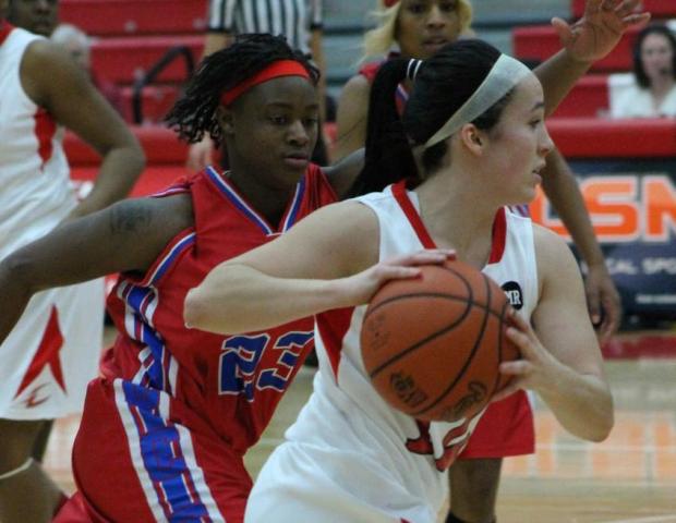Danielle Bezeau drives by a Cuyahoga defender looking to make a pass. The sophomore point guard finished with a near triple-double (7 points, 12 rebounds, 14 assists, 4 steals). Her assist mark broke the single game record. Photo by Dave Harrand/Owens Sports Information