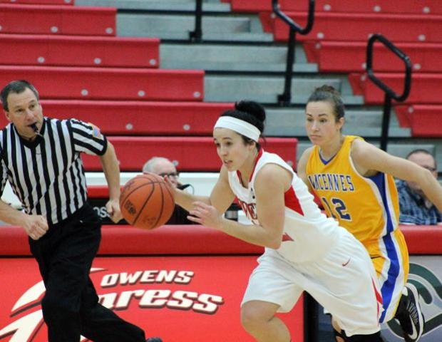 Danielle Bezeau flies by Zhanna Chuckhrii of Vincennes during a second half fast break. Bezeau scored a career-high 14 points to go with seven rebounds, four assists and four steals. Photo by Dave Harrand/Owens Sports Information
