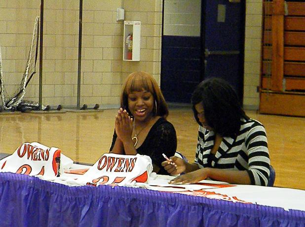 Breonna House, left, celebrates as her teammate Meshia Smith signs her letter of intent to play for the Express women's basketball team. Both players will join an eight player recruiting class. Photo by Nicholas Huenefeld/Owens Sports Information