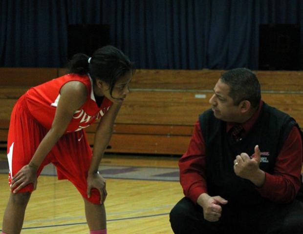 Uniqua Mitchell talks with head coach Mike Llanas during a free throw attempt for Lakeland. She scored a team-high 18 points in the win. Photo by Nicholas Huenefeld/Owens Sports Information
