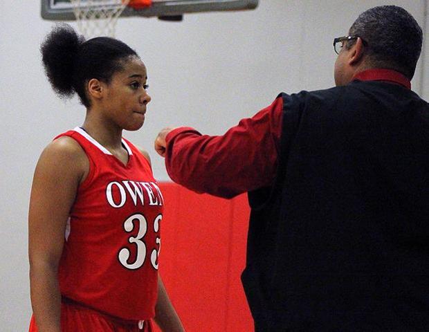 Ashley Tunstall, pictured here talking with head coach Michael Llanas, had 13 points and 13 rebounds in a 54-52 win today. Photo by Nicholas Huenefeld/Owens Sports Information