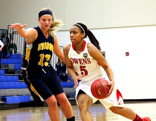 Kamilah Carter, pictured here driving by an Edison Community College defender in last year's district semifinals, has signed with IPFW. Photo by Geoff Roberts/Owens Sports Information