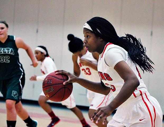 Sierra Harley starts a fast break in today's 104-65 win over Delta College. The freshman guard had 21 points, eight rebounds and six assists. Photo by Nicholas Huenefeld/Owens Sports Information