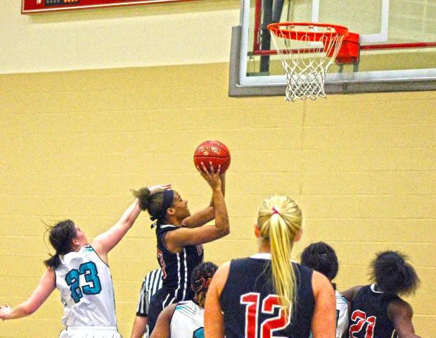 Ashley Tunstall goes up for a basket during the first half of tonight's 101-56 win over Cuyahoga. Photo by Nicholas Huenefeld/Owens Sports Information