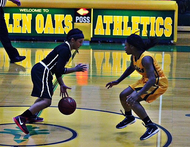 Briana Williams looks to make a move against a Glen Oaks defender in tonight's 74-51 win. Photo by Nicholas Huenefeld/Owens Sports Information