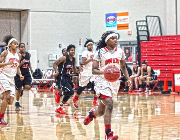 Courizma Williams brings the ball up the court on a fast break during the second half of today's 67-52 win over Sinclair. The freshman guard had a game-high 16 points. Photo by Tobias Flemming/Owens Sports Information