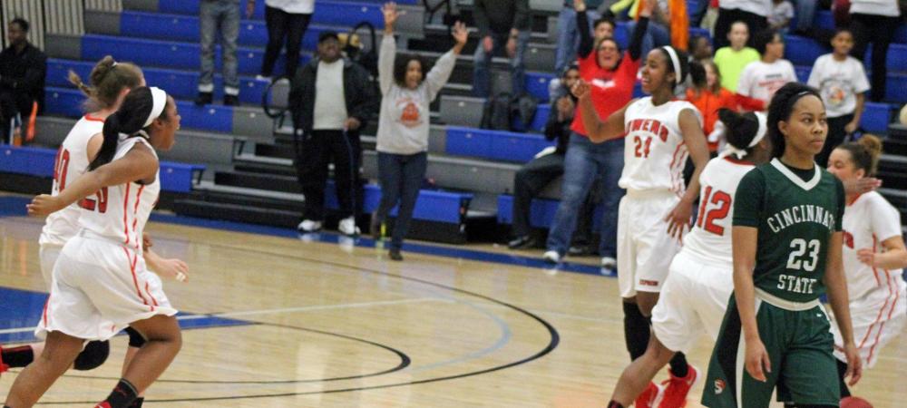 Ariel Bethea (24) and the Owens women's basketball team rushes the court after the final second ticked off the clock in yesterday's district title game. Photo by Nicholas Huenefeld/Owens Sports Information