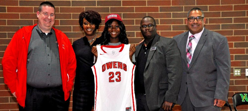 Denissa Sly is pictured holding an Owens jersey on signing day. Photo provided by Robin Spiller