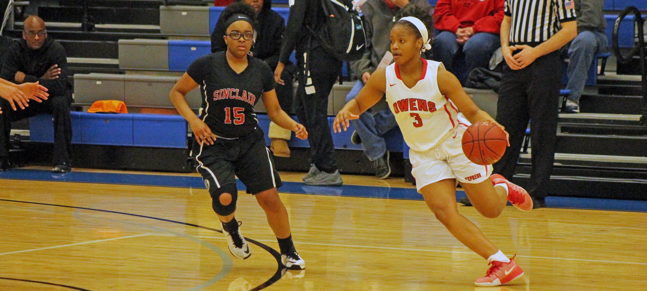 Essence Cowan looks to make a move against Sinclair's Reanna Dudley in today's district semifinal game. Photo by Nicholas Huenefeld/Owens Sports Information