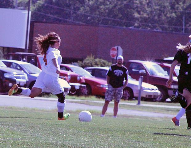 Kendyl Christian looks to make a move in the first half of today's 3-1 loss to Schoolcraft. The freshman scored the lone goal of the game for the Express. Photo by Nicholas Huenefeld/Owens Sports Information