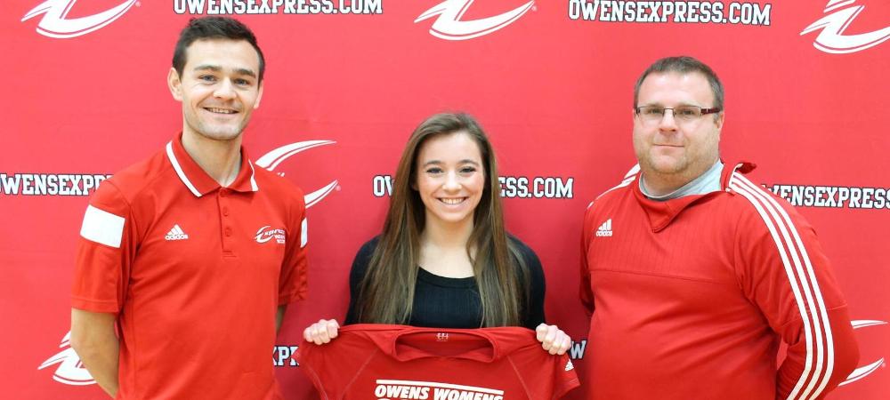 Megan Welker is joined by the Owens coaching staff after signing an LOI to play women's soccer next year. Photo by Nicholas Huenefeld/Owens Sports Information