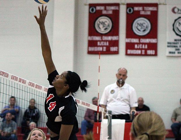 Jazmine Thomas, pictured here playing a ball at the net, finished with a team-high eight blocks today as the Express swept Cuyahoga on the road. Photo by Nicholas Huenefeld/Owens Sports Information