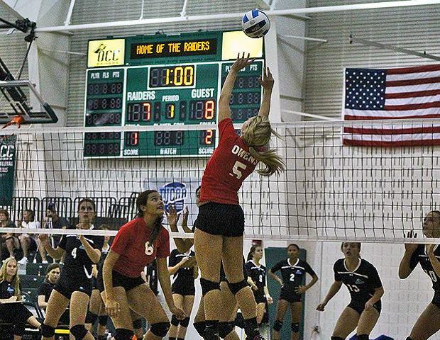 Jessica Cooper, pictured here setting the ball in the Oakland CC Block City Classic, had 28 assists today in two matches. Photo by Nicholas Huenefeld/Owens Sports Information