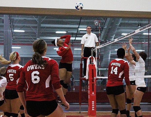 Tiffani Hobbs prepares to strike the ball against Mott Community College on Friday. The sophomore had 12 kills in the match. Photo by Nicholas Huenefeld/Owens Sports Information