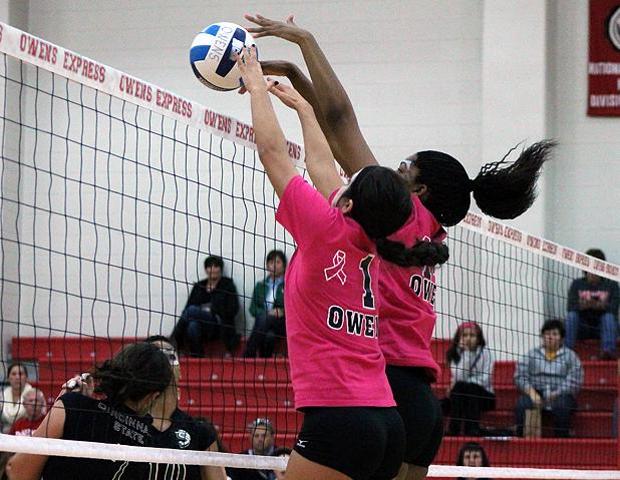Ciarra Wirick and Jazmine Thomas (L to R) stuff a kill attempt by Cincinnati State early in tonight's straight set Express victory. The duo combined for 22 kills. Photo by Nicholas Huenefeld/Owens Sports Information