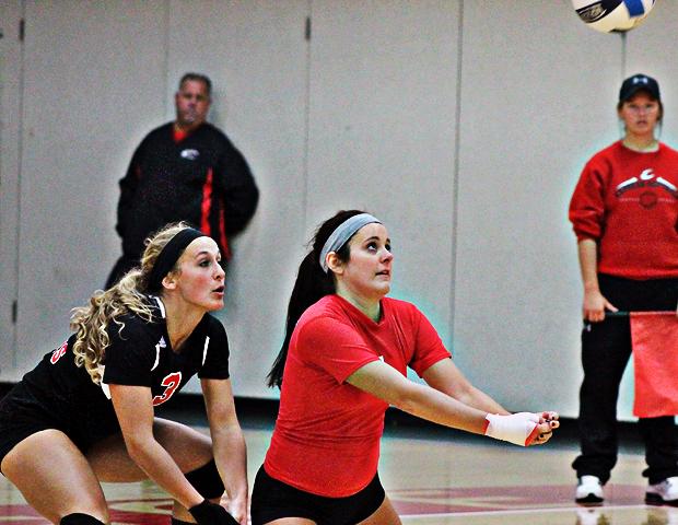 Ciarra Wirick (right), digs a ball as Aricka LaVoy looks to help. Wirick had 54 digs in three matches today. Photo by Nicholas Huenefeld/Owens Sports Information