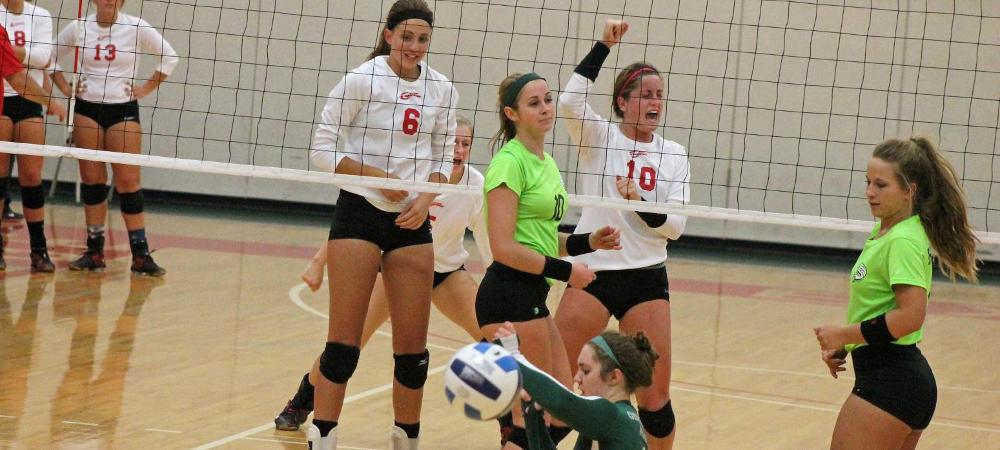 Macy Reigelsperger (10) celebrates a point, while Annie Lindeman (6) looks on. Photo by Nicholas Huenefeld/Owens Sports Information