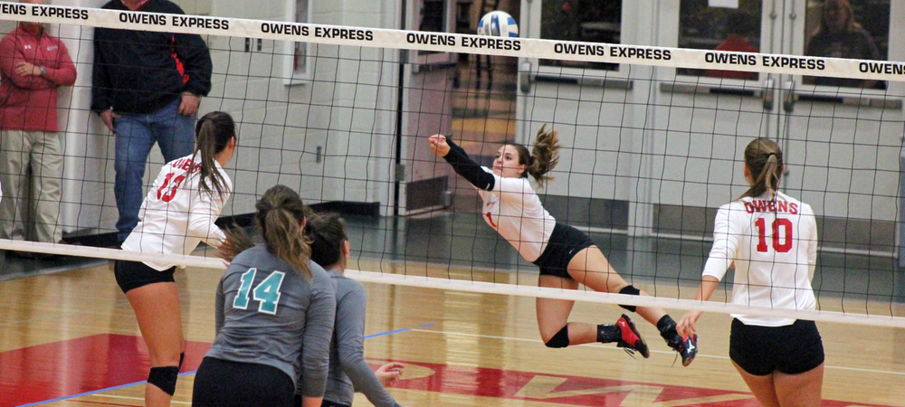 Niki Polce makes a diving save during tonight's second set. Photo by Nicholas Huenefeld/Owens Sports Information