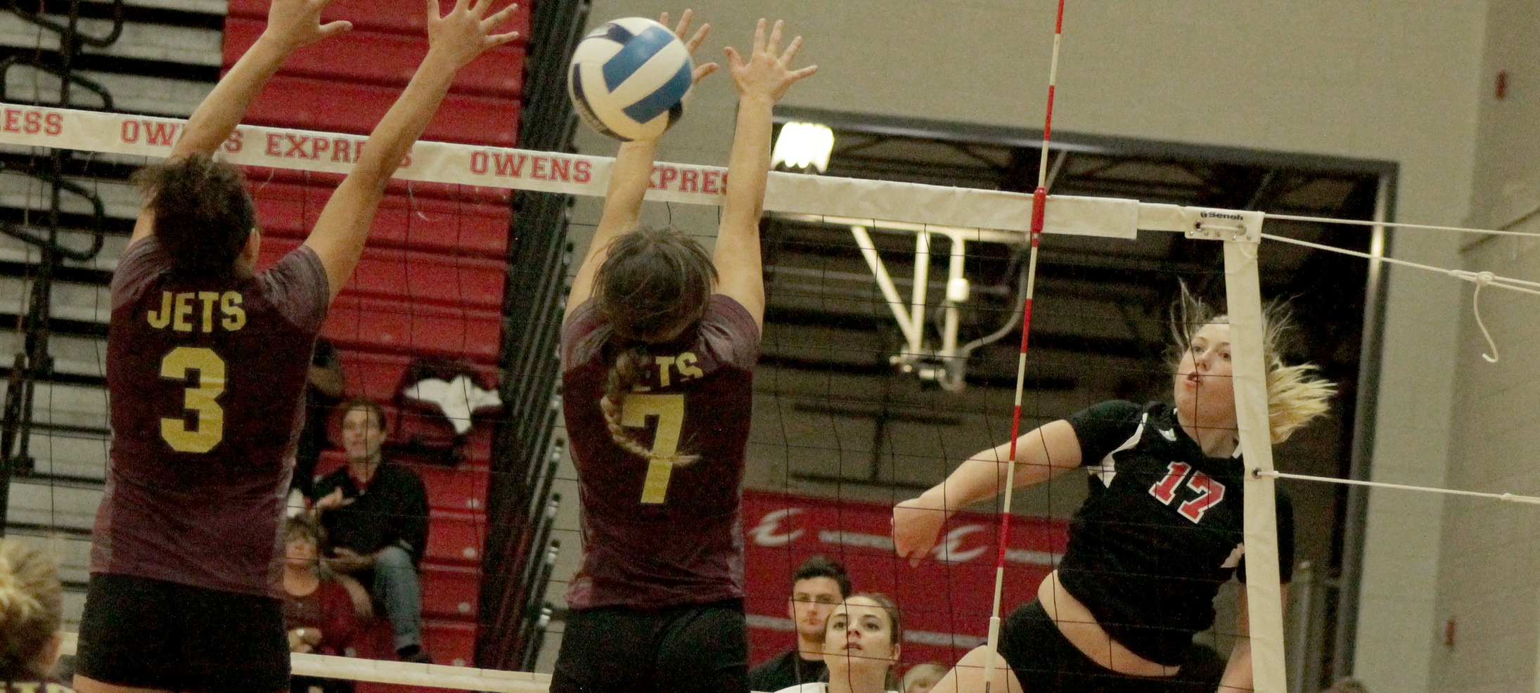 Michaela Eisenhauer hits it through the block in Friday's win over Jackson. Photo by Nicholas Huenefeld/Owens Sports Information