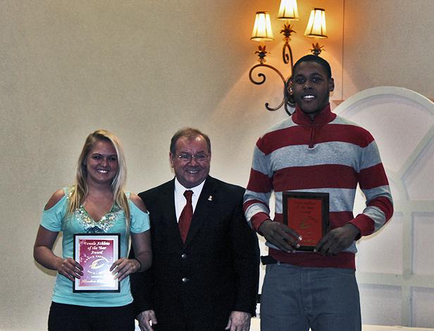 Owens Community College President Dr. Mike Bower (center) poses with female athlete of the year Kendra Eitniear and male athlete of the year James Kelly. Photo by Nicholas Huenefeld/Owens Sports Information