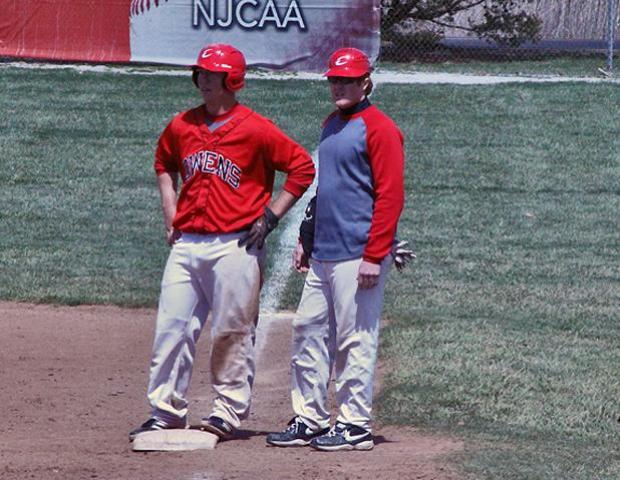 Austin Cowan is shown here standing with assistant coach Zach Tanner in a game against Sinclair this past weekend. Photo by Amanda Flowers/Owens Sports Information