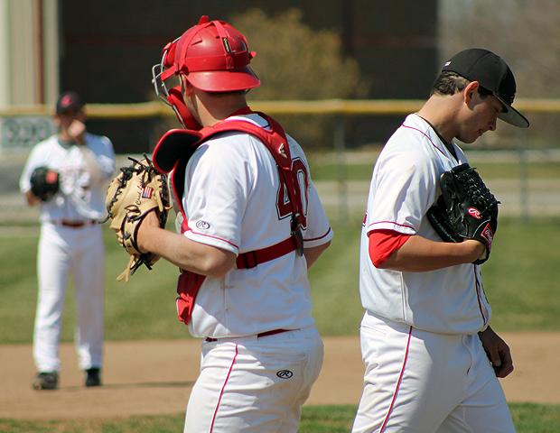 Michael Finch (right) and Chad Lupher (left) break a huddle at the mound in today's first game. Photo by Geoff Roberts/Owens Sports Information