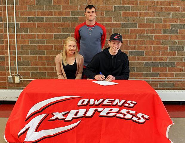 Bowsher's Will Hutt, front right, is joined by his girlfriend, as well as Express baseball head coach Devin Taylor as he signs his letter of intent. Photo by Nicholas Huenefeld/Owens Sports Information