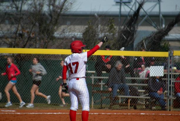Michelle Hollister signals to the dugout after reaching second base in the sixth inning. The sophomore second baseman finished 2-for-2 with a walk, three runs and three RBIs. She hit a three run homer in the fourth inning. Pictured below is Ashlyn Michalak, who struck out 10 in six scoreless innings to lower her ERA to 0.44. Photos by Nicholas Huenefeld/Owens Sports Information