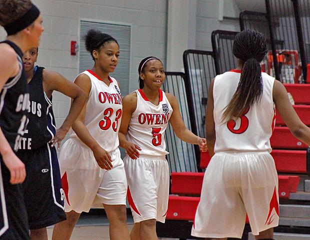 Kamilah Carter (5) joins her teammates, Ashley Tunstall (33) and Zhana Randolph (3) after making a lay-up and getting fouled. That trio combined for 48 points. Photo by Nicholas Huenefeld/Owens Sports Information
